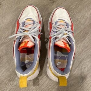 Nike tennis shoes. Women’s 8, white/blue/yellow/red platform shoes.